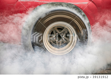 Drag racing car burn tire at starting line. Drag racing car burn tire at starting line. 39131912