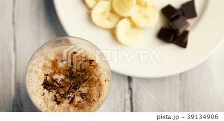 Banana chocolate smoothie with a dash of cinnamon. Banana chocolate smoothie with a dash of cinnamon. 39134906