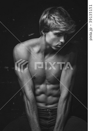 Young Handsome man portrait at dark background 39135151