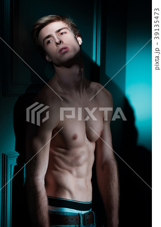 Young Handsome man portrait at dark background Young Handsome man portrait at dark background 39135473