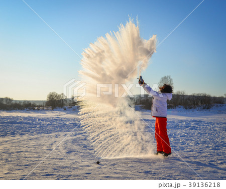 People throwing snow at sunrise People throwing snow at sunrise 39136218