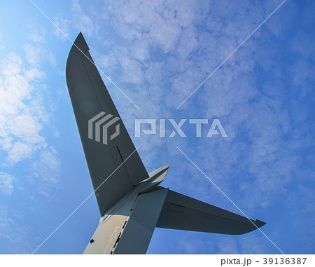 Tail of an aircraft against blue sky 39136387