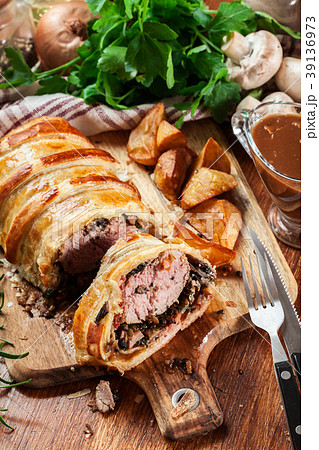Pork tenderloin in wellington style in puff pastry Pork tenderloin in wellington style in puff pastry 39136973