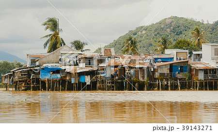 Slums in Nha Trang. Houses on the river. Vietnam. Slums in Nha Trang. Houses on the river. Vietnam. 39143271
