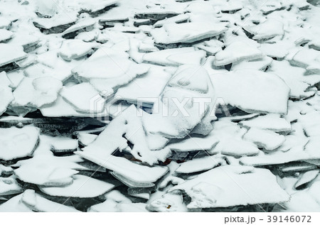 Natural broken ice blue covered with snow Natural broken ice blue covered with snow 39146072