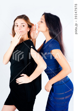 Two gossiping girlfriends 39147978