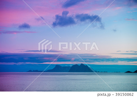 An island with a mountain on the horizon An island with a mountain on the horizon 39150862