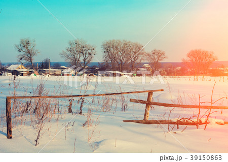 Snowy rural landscape with wooden fence in winter Snowy rural landscape with wooden fence in winter 39150863