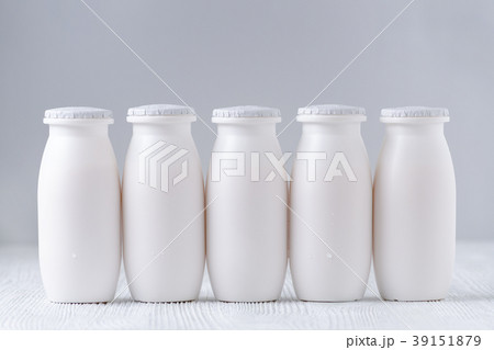 five bottles of drink yogurt on gray background 39151879