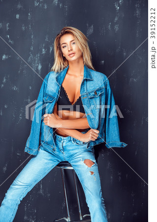 Portrait of pretty blonde woman sits on a chair 39152212