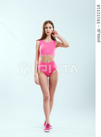Full length portrait of young beautiful girl in pink sportswear 39152318