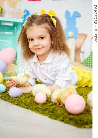 Content kid with ducks on lawn 39152492