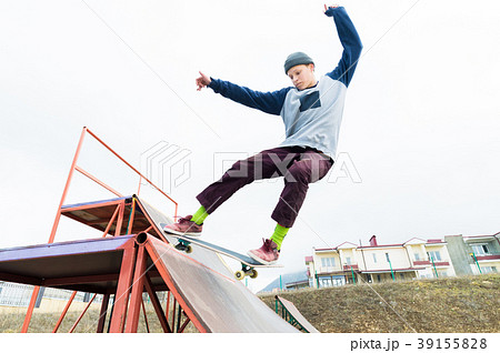Teen skater in a hoodie sweatshirt and jeans Teen skater in a hoodie sweatshirt and jeans 39155828