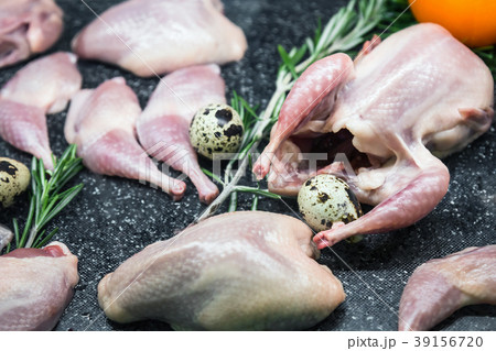 carcass of quail and quail egg on the kitchen  39156720