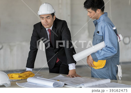 Businessman look outside he so seriously. Businessman look outside he so seriously. 39162475