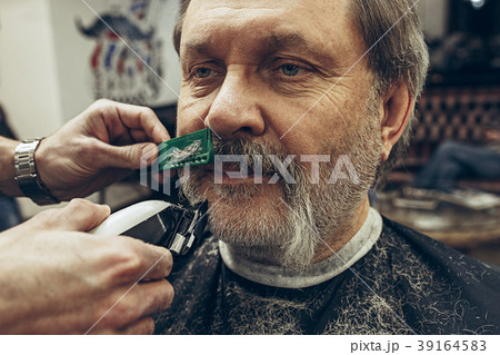 Close-up side view portrait of handsome senior 39164583