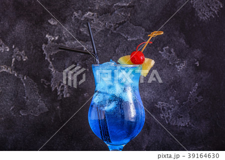 Blue Curacao cocktail decorated with fruit. 39164630