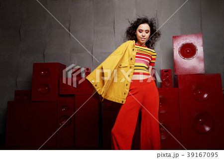 Studio fashion shooting. The girl in a bright 39167095