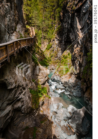 Vertical shot of path in Gorner Gorge with river 39176041
