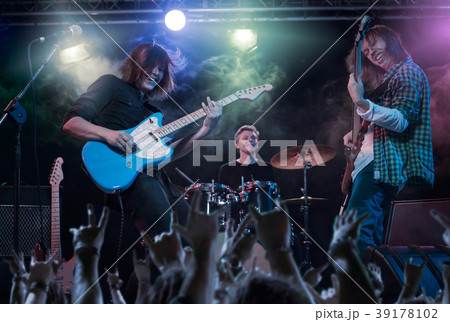 Performance of the rock band. 39178102