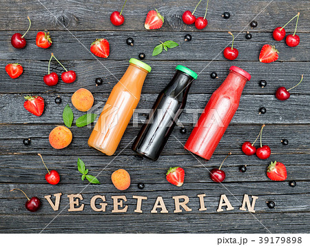 Three bottles with juice, fruit 39179898