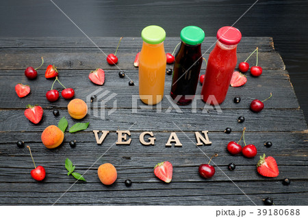 Three bottles with juice, fruit Three bottles with juice, fruit 39180688