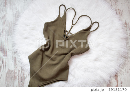 Khaki body on white fur. Fashionable concept Khaki body on white fur. Fashionable concept 39181170