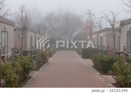 foggy street among camp houses 39181340