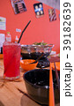Beverage, cup, chopsticks and sukiyaki. 39182639