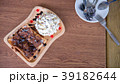Toast bread with ovaltine and cream in wood dish. 39182644