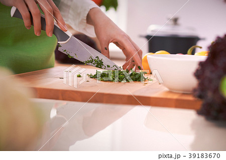 Close Up of human hands cooking vegetable salad in 39183670