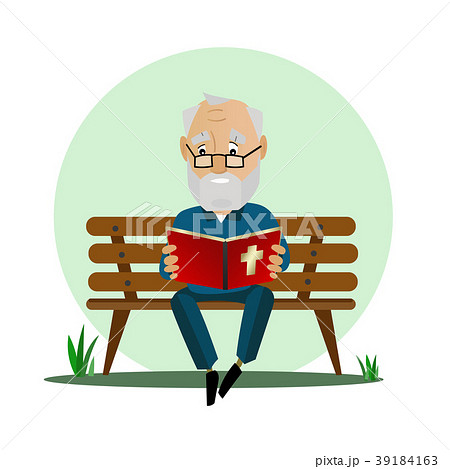 Elderly man reads the Bible while sitting on a 39184163