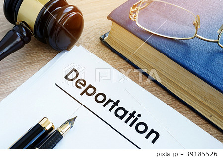 Deportation and other documents on a desk. 39185526