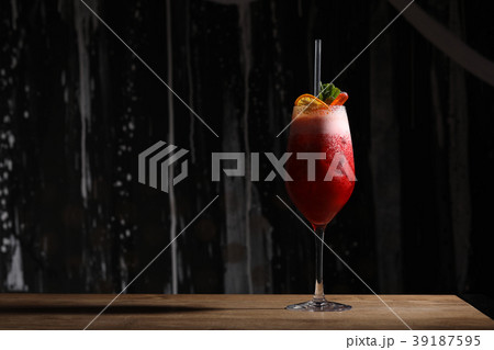 Raspberry cocktail with foam. Close up. Black 39187595