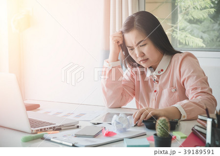 Sad business woman sitting in office 39189591