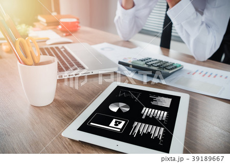 Businessman hand working with financial data Businessman hand working with financial data 39189667