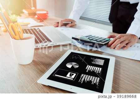 Businessman hand working with financial data Businessman hand working with financial data 39189668