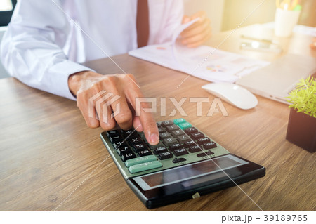 Businessman hand working with financial data Businessman hand working with financial data 39189765