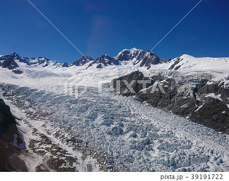 Fox glacier against clear blue sky background 39191722