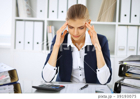 Tired business woman or female accountant with 39193075