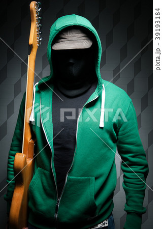 Portrait of a guitarist  at dark background 39193184