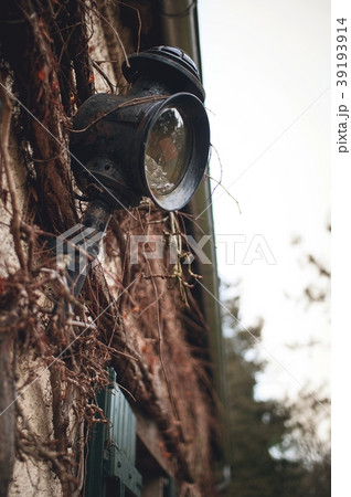 Old wall lantern in a rustic style Old wall lantern in a rustic style 39193914