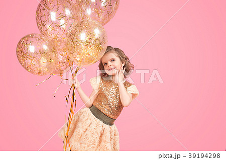Cheerful festive girl with bunch of balloons 39194298
