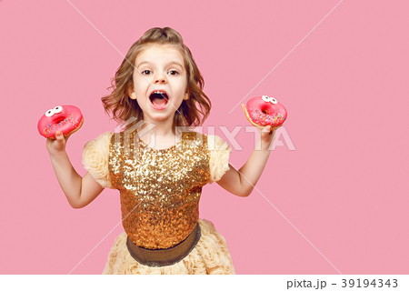 Little girl in dress with donuts Little girl in dress with donuts 39194343