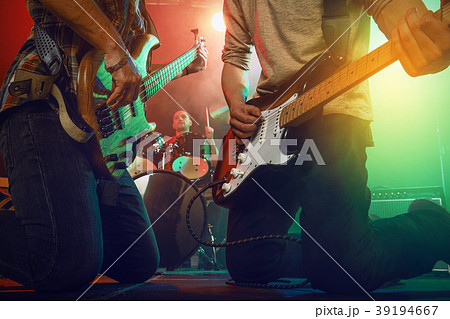 The musician plays an acoustic guitar. Scene 39194667