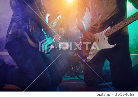 The musician plays an acoustic guitar. Scene 39194668