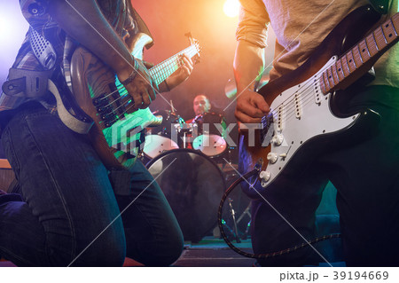 The musician plays an acoustic guitar. Scene 39194669