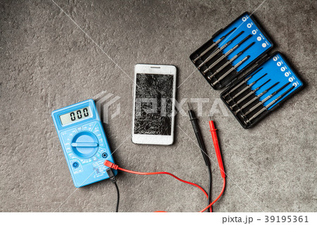Digital multimeter on grey background 39195361