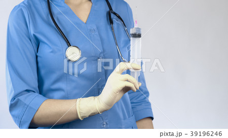 Veterinarian with syringe in hand, euthanasia of Veterinarian with syringe in hand, euthanasia of 39196246