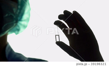 Doctor hand holding vaccine closeup, life-saving Doctor hand holding vaccine closeup, life-saving 39196321